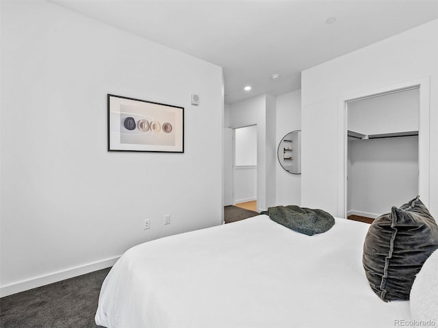 1601 Park Ave Unit 212, Denver, CO 80218 - bedroom with baseboards, dark carpet, and recessed lighting