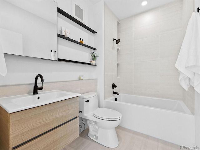 1601 Park Ave Unit 212, Denver, CO 80218 - full bath featuring bathtub / shower combination, visible vents, toilet, vanity, and tile patterned flooring