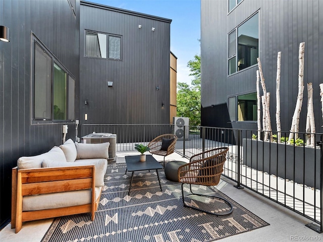 1601 Park Ave Unit 212, Denver, CO 80218 - view of patio with central AC unit and outdoor lounge area