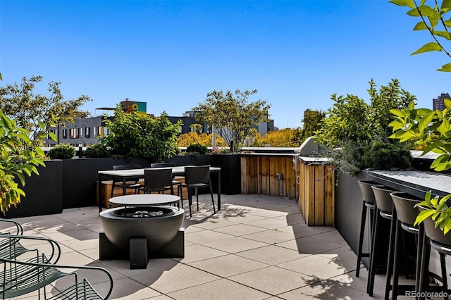 1601 Park Ave Unit 212, Denver, CO 80218 - view of patio / terrace featuring outdoor dining area, an outdoor kitchen, and outdoor wet bar