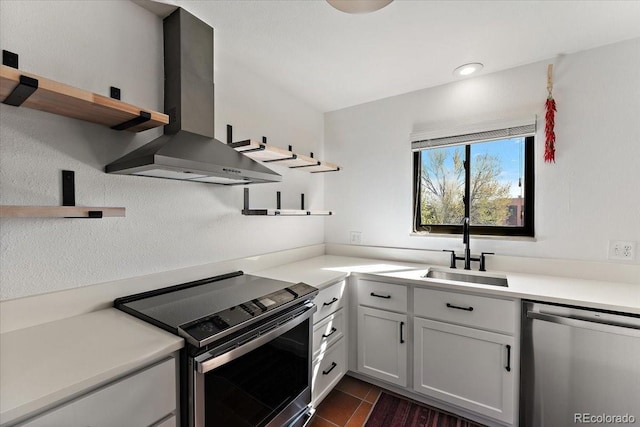 2979 Mesa Rd Unit D, Colorado Springs, CO 80904 - kitchen featuring open shelves, appliances with stainless steel finishes, wall chimney range hood, a sink, and light countertops