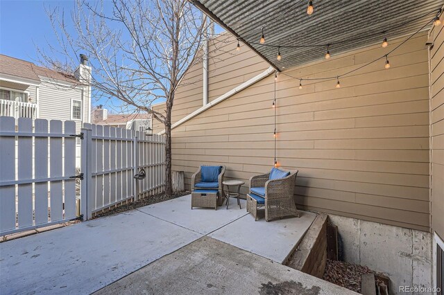 view of patio / terrace featuring a gate and fence