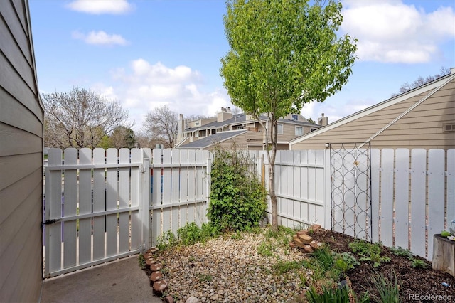 view of yard featuring a gate and fence