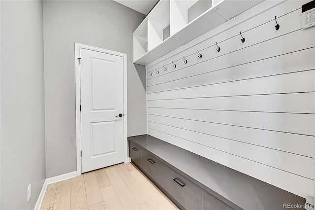 mudroom with light wood-style flooring and baseboards