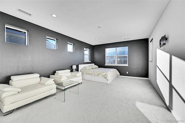 bedroom featuring baseboards, visible vents, a textured wall, carpet flooring, and recessed lighting