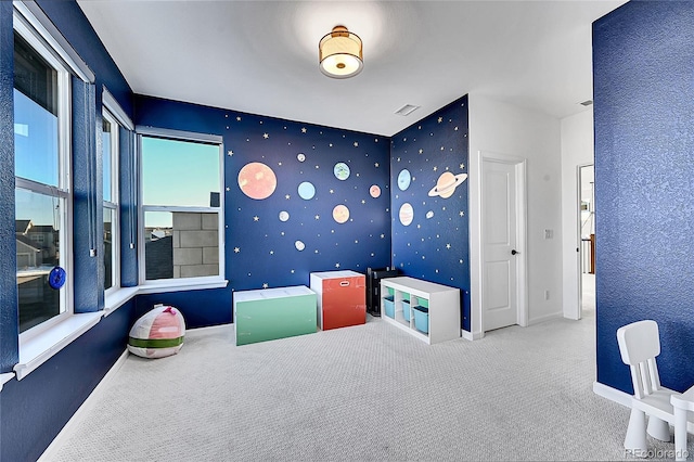 playroom featuring carpet flooring and baseboards