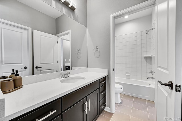 full bath with toilet, tile patterned flooring,  shower combination, and vanity