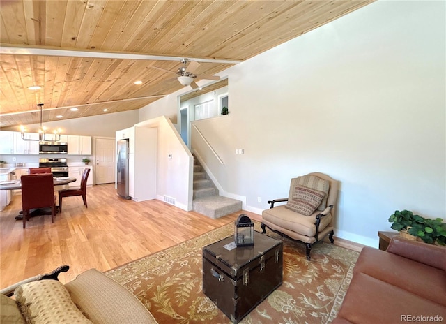 living room with wood ceiling, ceiling fan, vaulted ceiling, and light hardwood / wood-style floors