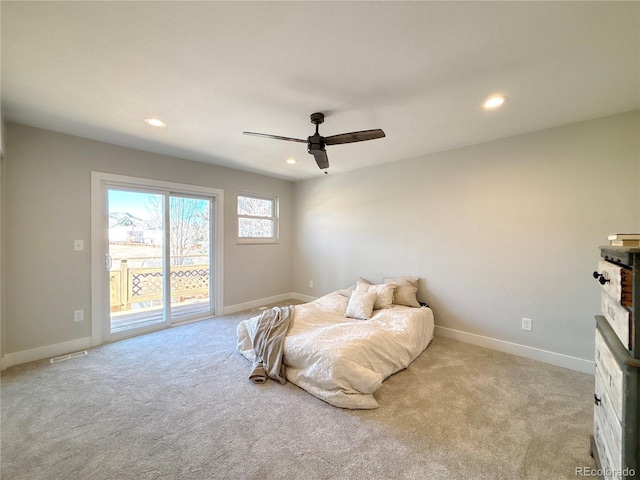 bedroom featuring light carpet, access to outside, and ceiling fan