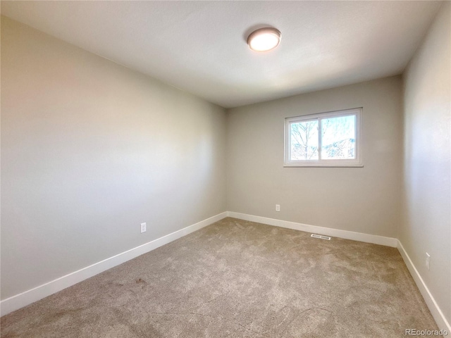 unfurnished room with carpet flooring