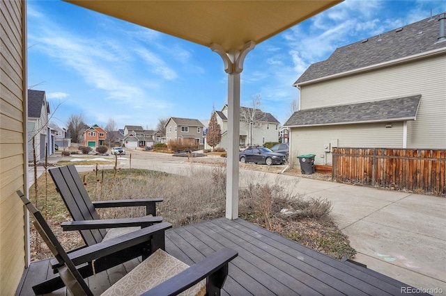 deck with fence and a residential view