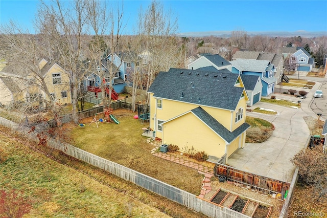 birds eye view of property with a residential view