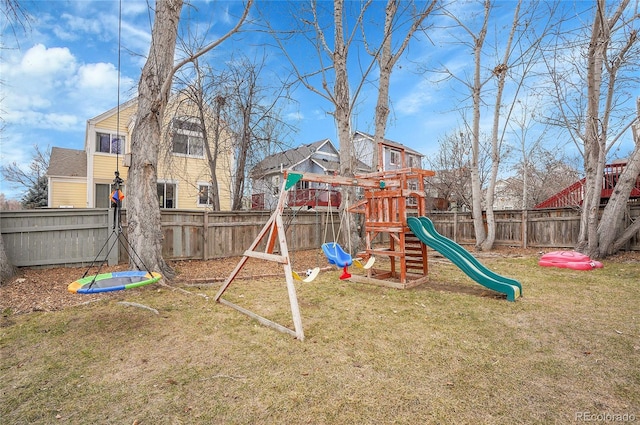 view of jungle gym featuring a fenced backyard and a yard