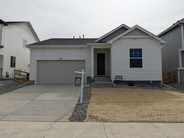 ranch-style home featuring board and batten siding, driveway, and a garage