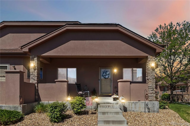 15501 E 112th Ave Unit 20C, Commerce City, CO 80022 - view of front of home featuring stucco siding and stone siding