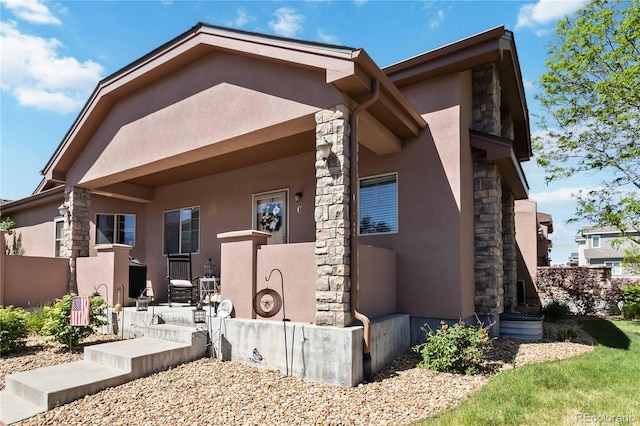 15501 E 112th Ave Unit 20C, Commerce City, CO 80022 - view of front of house with stone siding and stucco siding