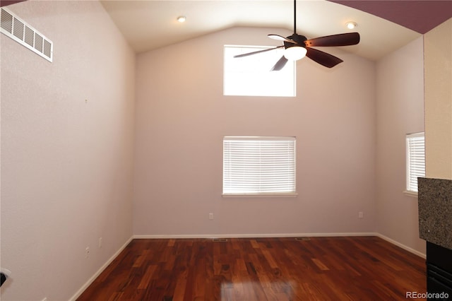 15501 E 112th Ave Unit 20C, Commerce City, CO 80022 - empty room featuring plenty of natural light, vaulted ceiling, dark wood-style flooring, ceiling fan, and baseboards