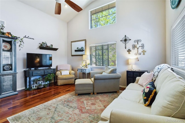 15501 E 112th Ave Unit 20C, Commerce City, CO 80022 - living area featuring healthy amount of natural light, a ceiling fan, wood finished floors, high vaulted ceiling, and baseboards
