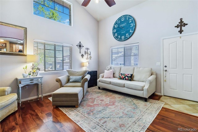15501 E 112th Ave Unit 20C, Commerce City, CO 80022 - living room featuring high vaulted ceiling, a ceiling fan, wood finished floors, and baseboards