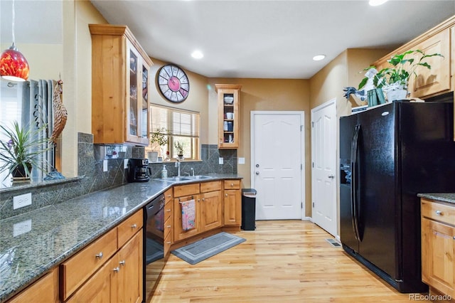 15501 E 112th Ave Unit 20C, Commerce City, CO 80022 - kitchen with black appliances, a sink, light wood-style floors, decorative backsplash, and recessed lighting