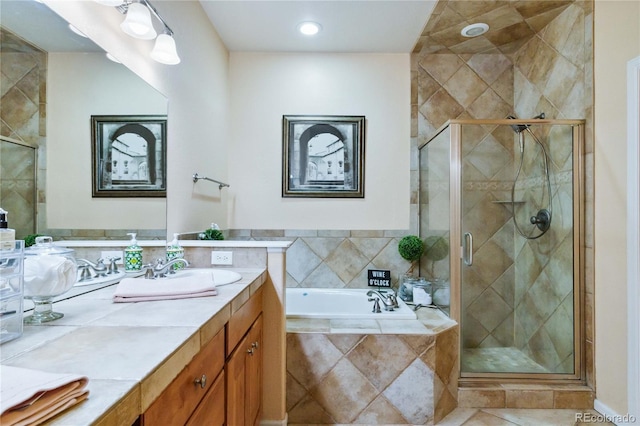 15501 E 112th Ave Unit 20C, Commerce City, CO 80022 - bathroom with vanity, a garden tub, a shower stall, recessed lighting, and tile patterned flooring
