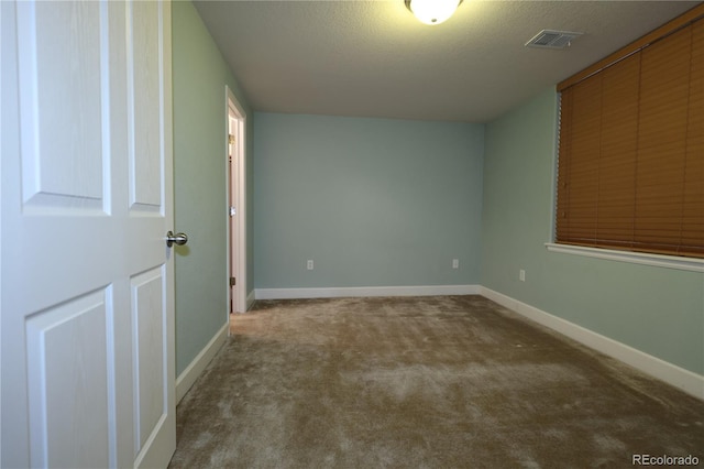 15501 E 112th Ave Unit 20C, Commerce City, CO 80022 - spare room featuring carpet floors, baseboards, and a textured ceiling