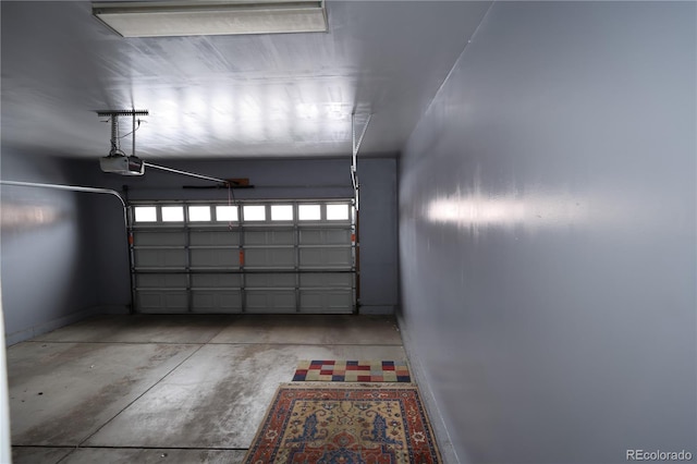 15501 E 112th Ave Unit 20C, Commerce City, CO 80022 - garage featuring a garage door opener and baseboards
