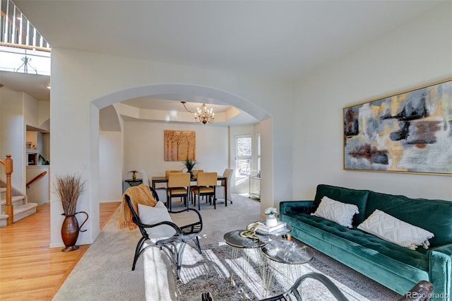 living room featuring light hardwood / wood-style floors and a chandelier