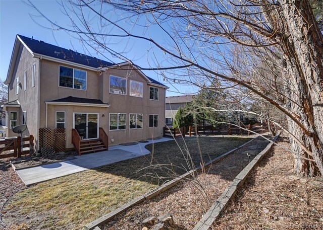 back of house featuring a patio area