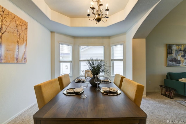 1460 Lily Lake Dr, Colorado Springs, CO 80921 - dining room with carpet floors, a raised ceiling, baseboards, and a chandelier
