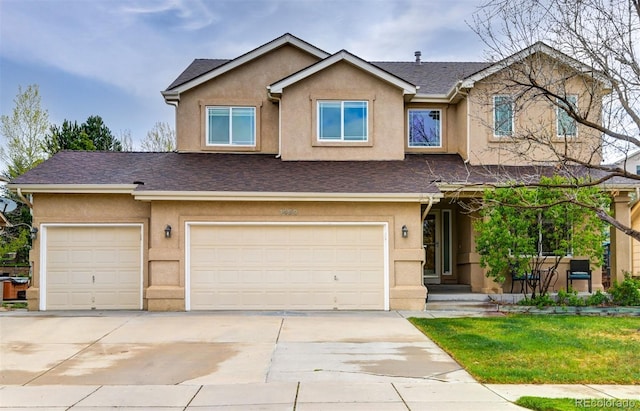 1460 Lily Lake Dr, Colorado Springs, CO 80921 - view of front of home with concrete driveway, an attached garage, roof with shingles, and stucco siding