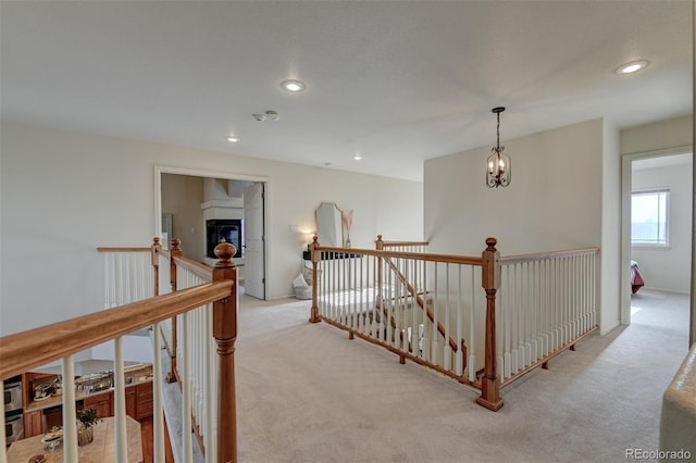 1460 Lily Lake Dr, Colorado Springs, CO 80921 - hall with carpet floors, recessed lighting, an upstairs landing, and an inviting chandelier