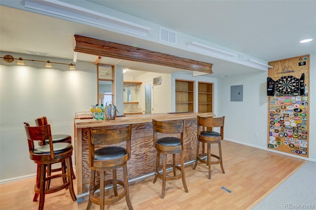 1460 Lily Lake Dr, Colorado Springs, CO 80921 - bar with baseboards, visible vents, bar area, and wood finished floors