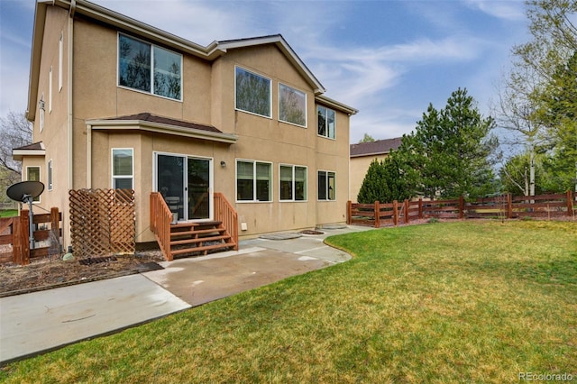 1460 Lily Lake Dr, Colorado Springs, CO 80921 - rear view of property with fence, stucco siding, entry steps, a patio, and a yard