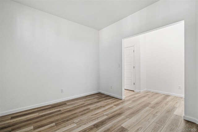 unfurnished room featuring light hardwood / wood-style floors