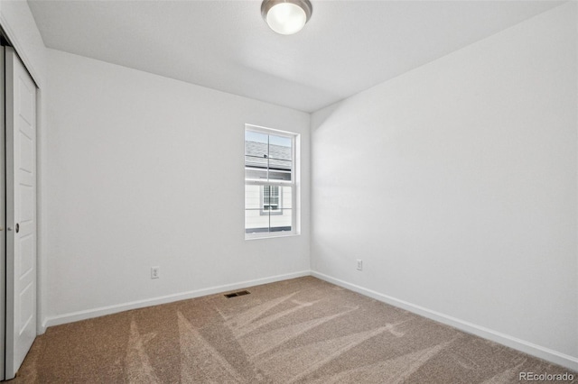 spare room featuring carpet flooring