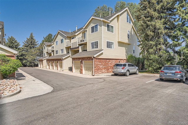 13704 E Lehigh Ave Unit D, Aurora, CO 80014 - multi unit property featuring brick siding and uncovered parking