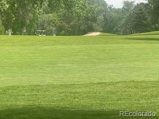 13704 E Lehigh Ave Unit D, Aurora, CO 80014 - surrounding community featuring view of wooded area and view of golf course