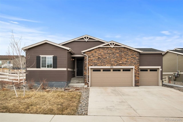 view of front of property with a garage and concrete driveway