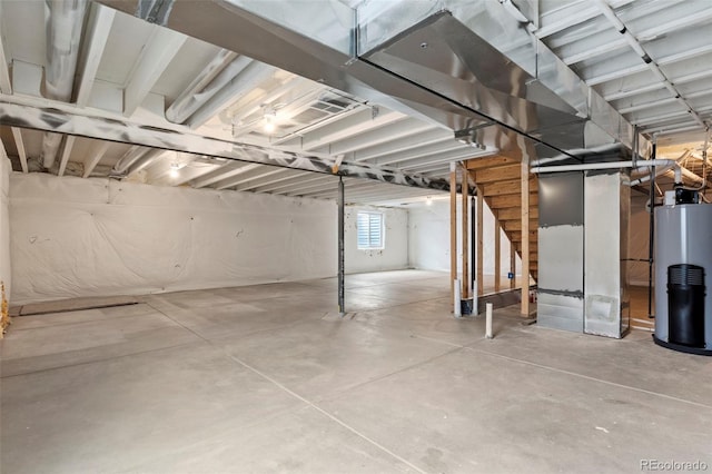 basement with water heater and heating unit