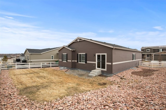 exterior space featuring entry steps and fence