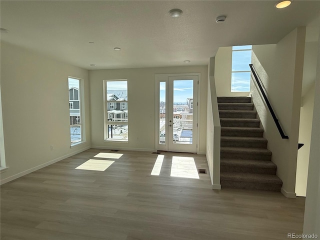 doorway to outside featuring light wood-type flooring