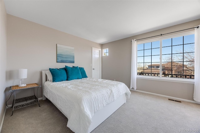 bedroom featuring carpet, visible vents, and baseboards