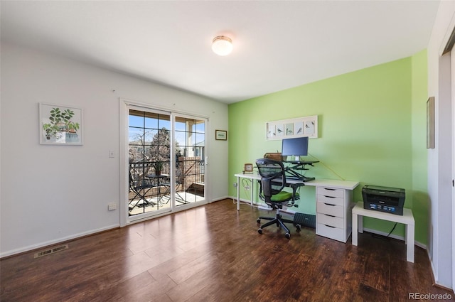 office with wood finished floors, visible vents, and baseboards