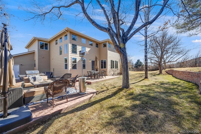 back of property with a patio and a yard