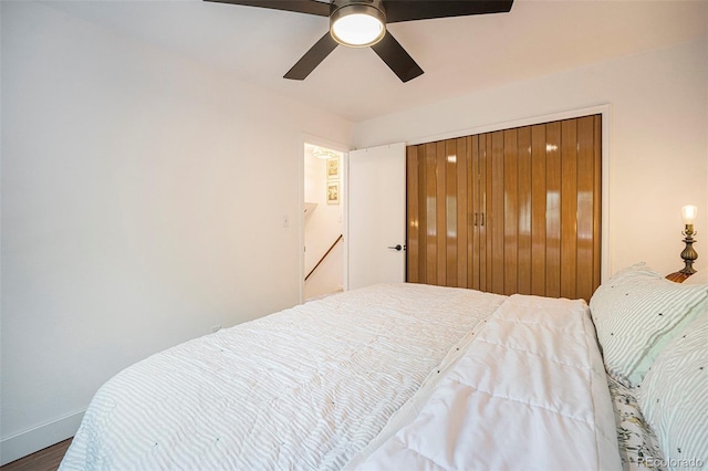 6248 W 75th, Arvada, CO 80003 - bedroom with wood finished floors, a ceiling fan, and a closet