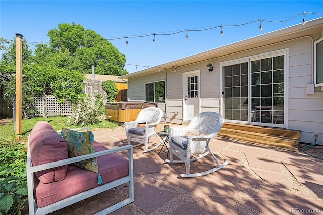 6248 W 75th, Arvada, CO 80003 - view of patio / terrace with a hot tub and entry steps