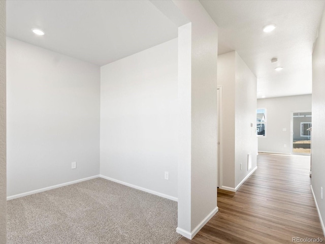 interior space with recessed lighting and baseboards