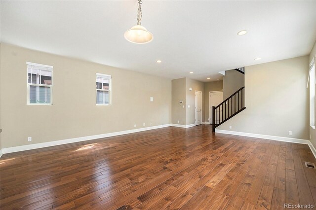 5434 N Xenia St, Denver, CO 80238 - unfurnished living room featuring hardwood / wood-style floors, stairs, and recessed lighting