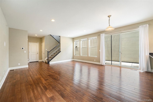 5434 N Xenia St, Denver, CO 80238 - unfurnished living room with wood-type flooring, stairs, and recessed lighting